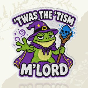 May include: Embroidered patch featuring a green frog wizard wearing a purple hat and cape, holding a staff with a blue skull. The text "TWAS THE 'TISM M'LORD" is arched above and below the frog.