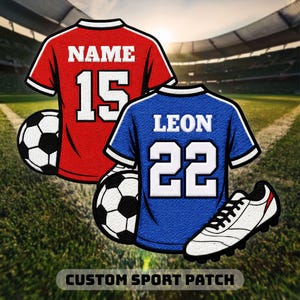 May include: Two embroidered sport patches featuring a red jersey with the text NAME and number 15, and a blue jersey with the text LEON and number 22. Each jersey is accompanied by a black and white football, and a white football boot.