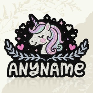 May include: Embroidered patch with a unicorn design. The unicorn has a pink blush, a purple and pink mane, and a horn. The design is set against a black background with the word "ANYNAME" in white script. Includes hearts and stars.