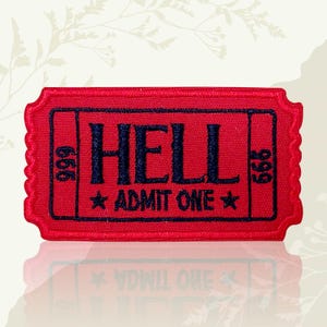 May include: A red embroidered patch in the shape of a ticket. The patch features the word "HELL" in dark blue, with "ADMIT ONE" and a star below. The numbers "666" and "999" are on either side.