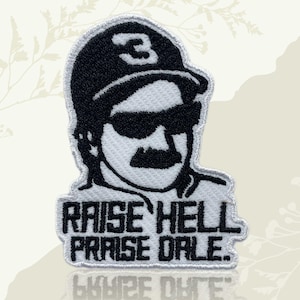 May include: Embroidered patch featuring a black and white portrait of a man wearing sunglasses and a cap with the number 3. The text "RAISE HELL PRAISE DALE" is embroidered below the portrait. The patch has a white border.