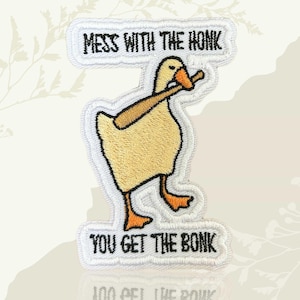 May include: Embroidered patch featuring a cartoon duck with a baseball bat. The text "MESS WITH THE HONK, YOU GET THE BONK" is embroidered above and below the duck. The duck is yellow with orange feet and beak.