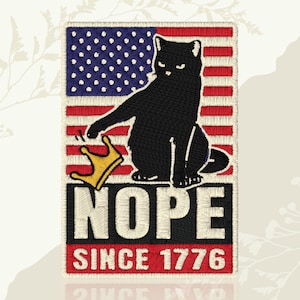 May include: A rectangular embroidered patch featuring a black cat sitting in front of an American flag. The cat is batting at a gold crown. Below the cat, the text NOPE is stitched in white, followed by the red-stitched text SINCE 1776 at the bottom.
