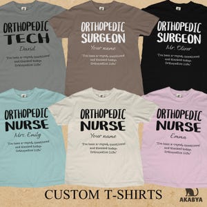 May include: A collection of six short-sleeved t-shirts in grey, brown, black, light blue, cream, and light pink. Each shirt features printed text including job titles like Orthopedic Tech, Surgeon, or Nurse, a name, and the phrase I've been x-rayed, questioned and thanked today. Orthopedics life.