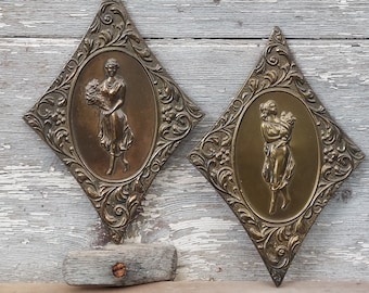 Hollywood Regency mid-century brass wall plaques