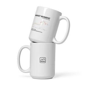 May include: Two white ceramic mugs stacked on top of each other. The top mug has the text "MARKET MOMENT" and a chart graphic. The bottom mug has a logo with the text "MktMmt".