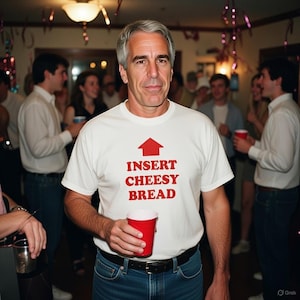 May include: A man wearing a white t-shirt with the text "INSERT CHEESY BREAD" in red, with an arrow pointing upwards. He is holding a red cup. The background shows a party setting with other people.