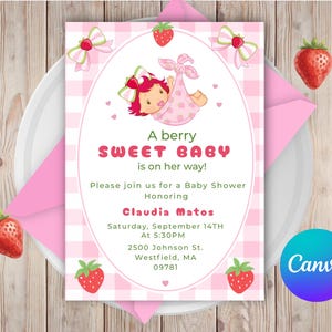 May include: A pink baby shower invitation with a strawberry theme. The invitation features a cartoon baby wrapped in a pink blanket, surrounded by strawberries and bows. Text reads "A berry SWEET BABY is on her way!"