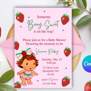 May include: A pink baby shower invitation with a strawberry theme. The invitation features the text "Berry Sweet is on the way!" and includes a cartoon illustration of a strawberry girl. The invitation also includes the date, time, and location of the baby shower.