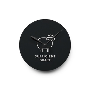 May include: A round, black wall clock with a white outline of a sheep and the words "SUFFICIENT GRACE" in white. The clock hands are black and point to the time.