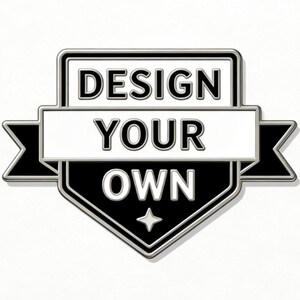 May include: A black and white badge with the text "DESIGN YOUR OWN". The badge has a shield shape with a star at the bottom and a banner across the middle. The text is in a bold, sans-serif font.
