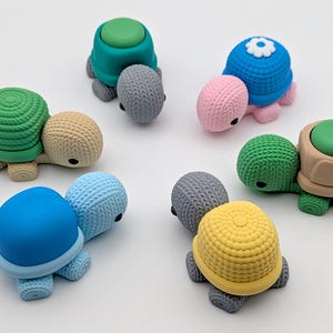 May include: A collection of colorful turtle-shaped erasers. The erasers feature various shell colors, including green, blue, pink, and yellow, with matching or contrasting bodies. The turtles have a textured design and black eyes.