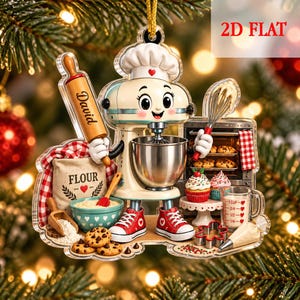 May include: A 2D flat Christmas ornament featuring a cartoon stand mixer character wearing a chef hat and red sneakers. The character holds a rolling pin labeled David and a whisk. Accessories include a flour bag, bowl, cookies, and oven.