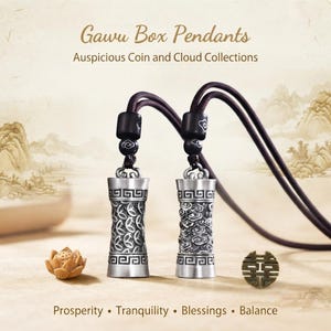 May include: Two silver-toned cylindrical Gawu box pendants on dark brown cords, featuring intricate coin and cloud relief patterns. The text reads: Gawu Box Pendants, Auspicious Coin and Cloud Collections, Prosperity, Tranquility, Blessings, Balance.
