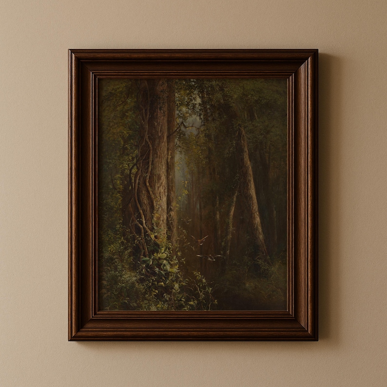 A framed forest landscape painting. The artwork depicts a dense forest with tall trees, lush green foliage, and a glimpse of sunlight filtering through the canopy. The frame is a dark brown color.
