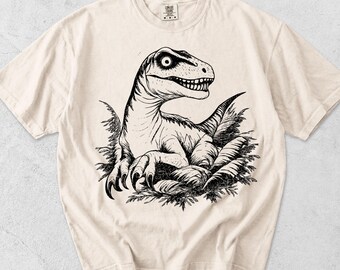 Velociraptor-boet, komfortfärgad t-shirt, dinosaurieägggrafik-t-shirt, retro dinosaurieälskare-gåva, förhistorisk paleontologi-t-shirt