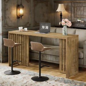 May include: A light brown wooden bar table with two matching bar stools. The table has a laptop with the time 10:30 displayed on the screen. A vase of pink flowers sits on the table. The stools have black bases and light brown seats.