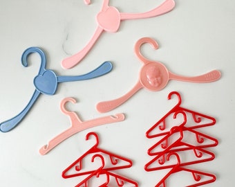 Vintage lot of 12 doll hangers / assorted sizes