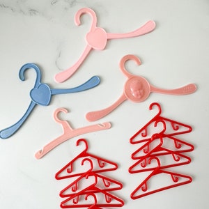 Vintage lot of 12 doll hangers / assorted sizes