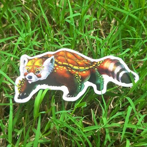 May include: A red panda with a shell-like pattern on its back. The panda is depicted in a running pose with its tail curled up. The image is a sticker.