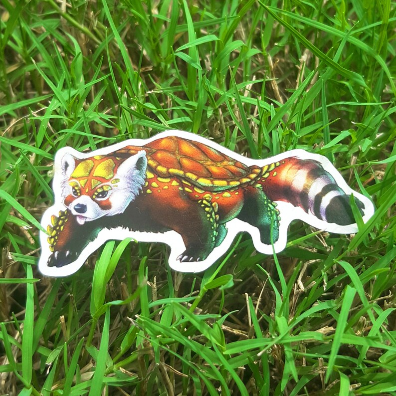 May include: A red panda with a shell-like pattern on its back. The panda is depicted in a running pose with its tail curled up. The image is a sticker.