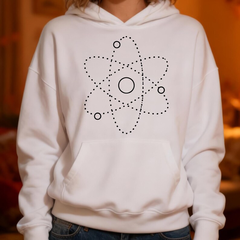 May include: White hoodie with a black atom graphic. The graphic shows a central circle surrounded by dotted lines and smaller circles, creating a scientific or abstract design. The hoodie has a front pocket and a hood.