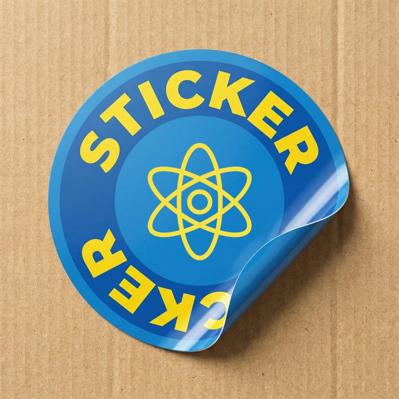 May include: A circular blue sticker with the word "STICKER" in yellow, curving around the edge. Inside is a yellow atom symbol. The corner of the sticker is peeled back, showing a white and blue gradient.