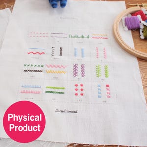 May include: A white fabric with various embroidery stitch examples in different colors. The fabric has a grid pattern with each square showcasing a different stitch. The text "Lucydiamond" is printed on the fabric.