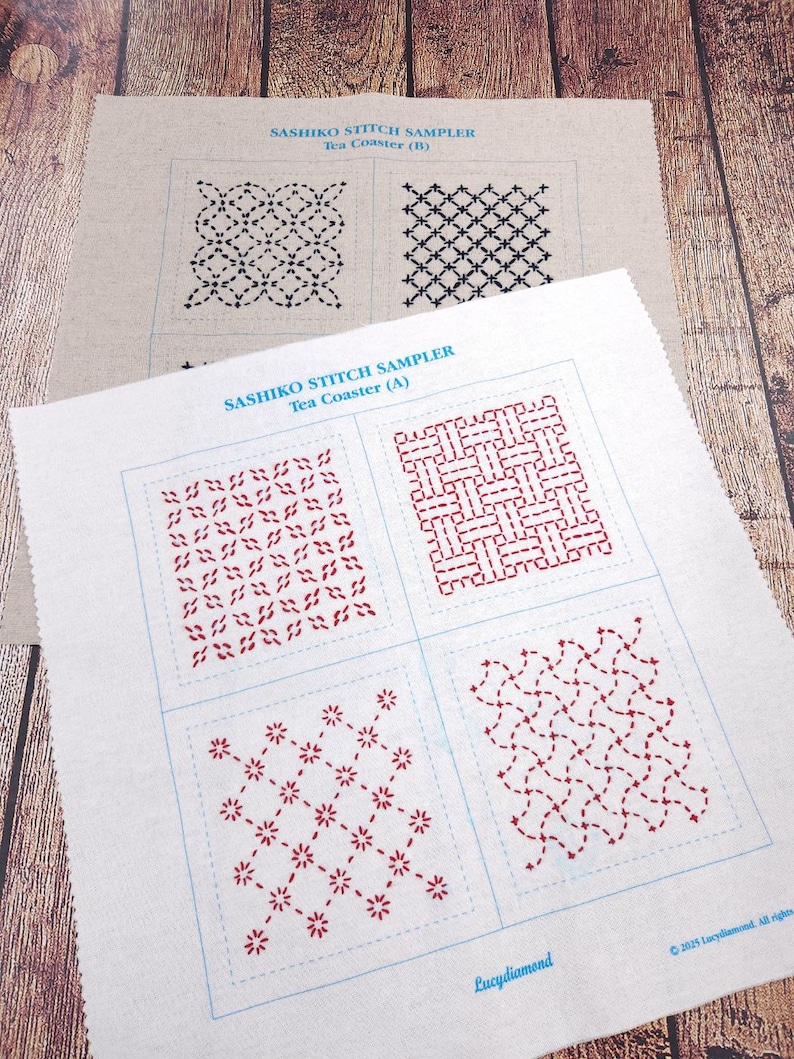 May include: Two off-white fabric squares featuring Sashiko stitch sampler patterns. The top piece is labeled Tea Coaster (B) with black geometric designs. The bottom piece is labeled Tea Coaster (A) with red geometric designs and the text Lucydiamond.