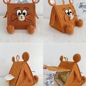 May include: A crocheted tissue box cover in the shape of Jerry Mouse from Tom and Jerry. The brown cover features Jerry's face, ears, and feet. The box is shown in different views, including open and closed.