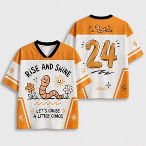May include: A white and orange V-neck jersey featuring a cartoon worm, flowers, and the text "RISE AND SHINE" and "LET'S CAUSE A LITTLE CHAOS" on the front. The back displays the number "24" in orange with a small worm graphic above it.