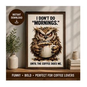 May include: A framed wall art print featuring a brown owl with a grumpy expression holding a white coffee mug. The text reads I DON'T DO MORNINGS. UNTIL THE COFFEE DOES ME. The background is off-white, and the frame is a dark brown wood finish.