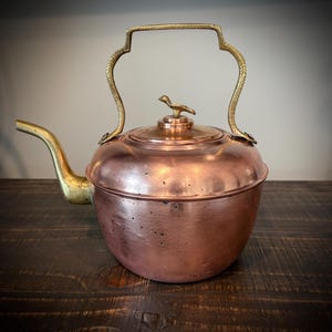 May include: A set of three ceramic mugs with a speckled, matte finish. The mugs are in shades of cream, light gray, and dark gray. Each mug has a simple, minimalist design, perfect for coffee or tea.