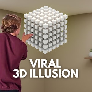 May include: A person interacting with a large, white, cube-shaped 3D illusion composed of smaller cubes. The words "VIRAL 3D ILLUSION" are displayed in large, white text below the cube. The background is a neutral-toned wall.