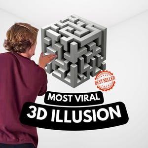 Puede incluir: Un laberinto cúbico 3D gris con un sello de "Best Seller" y el texto "MOST VIRAL 3D ILLUSION". El cubo es complejo y detallado, con una persona con una camisa granate tocando el cubo.