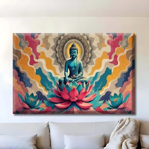 May include: A canvas print featuring a teal Buddha statue seated on a pink lotus flower. The artwork has a colorful background with a mandala design and is displayed above a modern sofa in a living room setting.