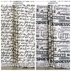May include: Two decorative curtain panels. One has black script on a cream background, labelled "AMBROISE." The other features a coffee-themed design with words like "Espresso" and "Latte" in black on a cream background, labelled "AMBRETTE."