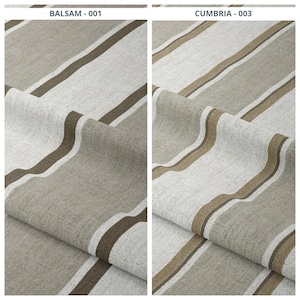 Puede incluir: Dos muestras de tela con un diseño a rayas. La muestra de la izquierda, etiquetada como "BALSAM - 001", presenta rayas anchas en tonos beige, marrón y blanco roto. La muestra de la derecha, etiquetada como "CUMBRIA - 003", tiene un diseño similar con ligeras variaciones de color.