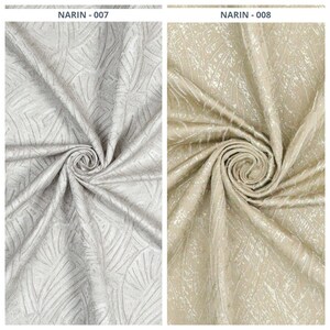 May include: Two fabric samples, one light gray and the other beige, each with a swirling pattern. The fabric has a textured appearance with a repeating leaf-like design. The text "NARIN - 007" and "NARIN - 008" are visible.
