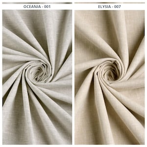 May include: Two swirled fabric samples. The left sample is labeled "OCEANIA - 001" and is a light beige color. The right sample, labeled "ELYSIA - 007", is a slightly darker beige. Both fabrics have a textured appearance.