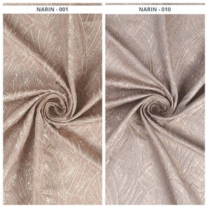 May include: Two swatches of fabric, one in a light taupe color and the other in a light grey color. Both fabrics have a textured, shimmering pattern with a leaf-like design. The text "NARIN - 001" and "NARIN - 010" are printed at the top of the image.