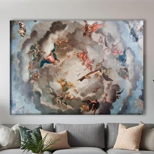 May include: Large rectangular canvas art depicting a Renaissance-style ceiling fresco with figures, clouds, and a central focus. The artwork features a palette of blues, browns, and reds. The canvas is displayed above a gray sectional sofa in a living room setting.