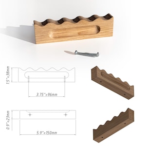 May include: A rectangular wooden cabinet pull with a wavy top edge and a recessed handle grip. The hardware includes a metal screw. Technical diagrams show a height of 1.5 inches, a length of 5.9 inches, a depth of 0.9 inches, and a 3.75 inch hole spacing.