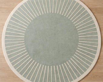 Alfombra redonda minimalista: patrón de líneas radiales modernas y suaves