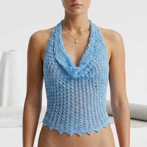 May include: A distressed wooden sign, inscribed with 'Welcome to our home' in white. The sign has a rustic finish, ideal for adding a welcoming touch to any entrance. The design is simple.