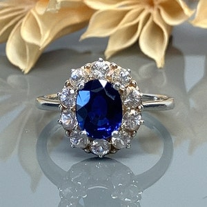 Oval Blue Sapphire and White Sapphire Halo Sterling Silver Engagement Ring- Size 7.5