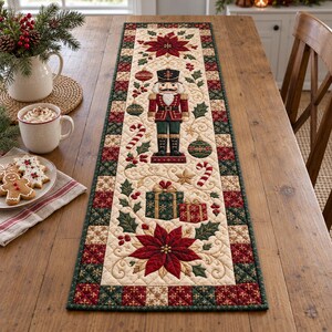May include: A rectangular quilted table runner featuring a central nutcracker figure, poinsettia flowers, wrapped gift boxes, and candy canes. The design includes a cream-colored background with a dark green and red checkered border.