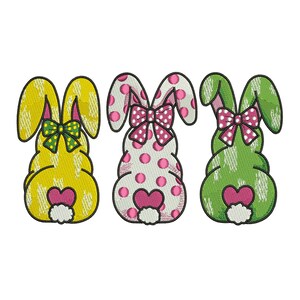 May include: Three Easter bunny designs. The bunnies are yellow, white with pink polka dots, and green. Each bunny has a bow, a heart, and a fluffy tail. The yellow bunny has a green bow, the polka dot bunny has a pink bow, and the green bunny has a pink bow.