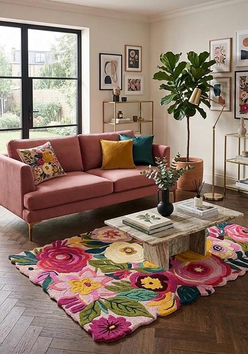 Unique wavy border irregular floral rug styled with a marble table and green plants for an aesthetic home look
