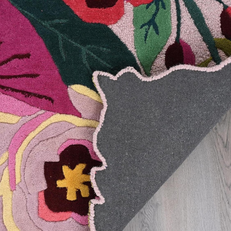 Backing of a handmade floral rug showing high-quality cotton canvas and artisan craftsmanship